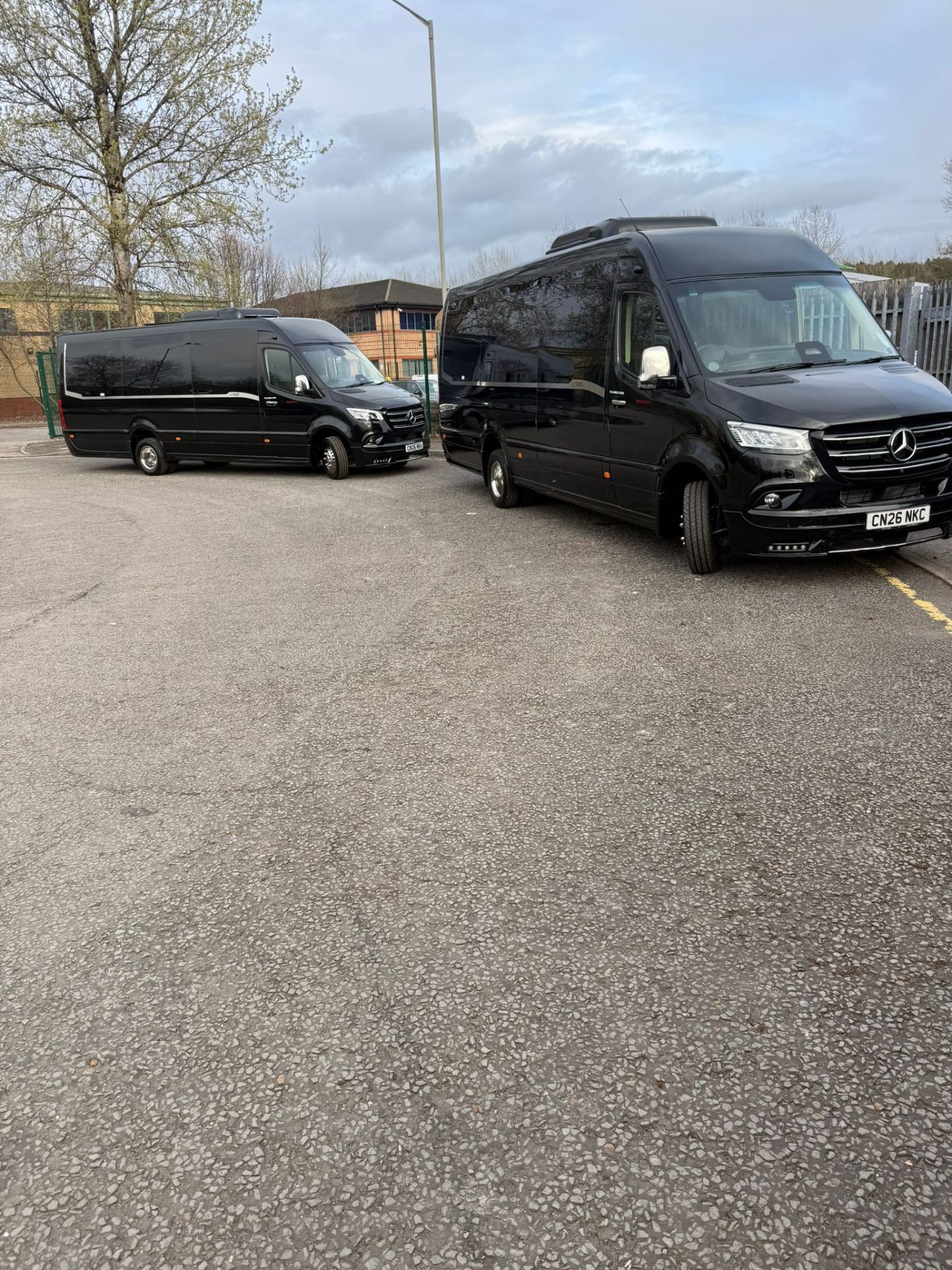 Sky Coaches black executive minibuses at depot